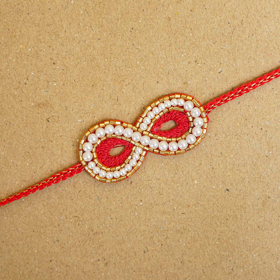 Handmade Beaded Infinity Rakhi With Roli Chawal