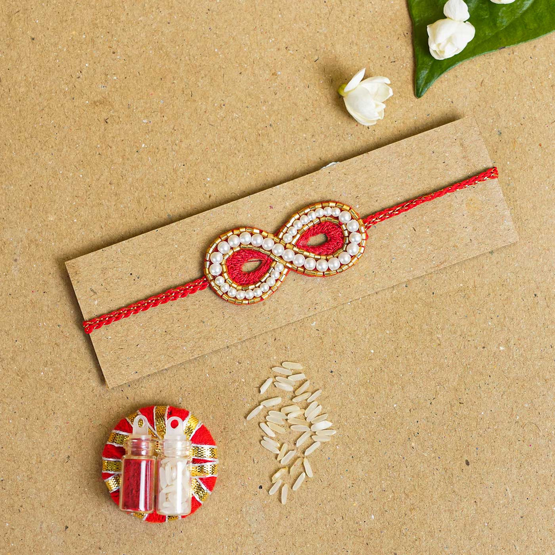 Handmade Beaded Infinity Rakhi With Roli Chawal