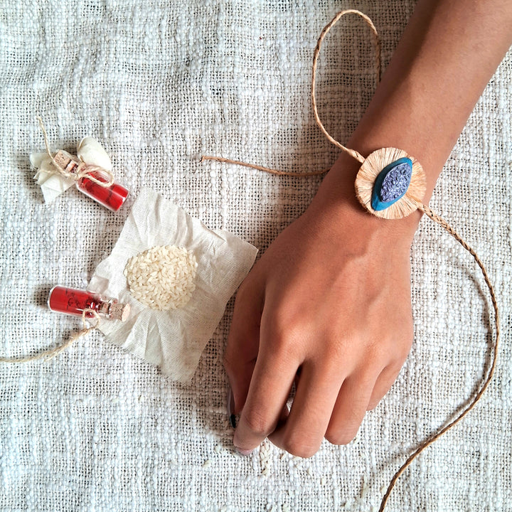 Handmade Papier Mache Naquashi Blue Rakhi With Roli Chawal