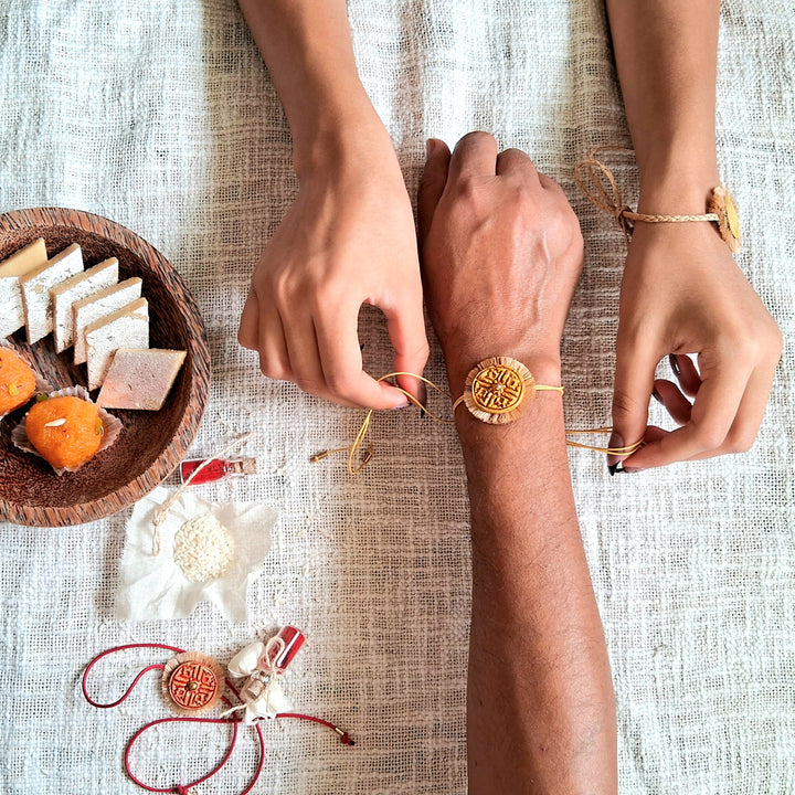 Handmade Papier Mache Red & Yellow Swastika Rakhi With Roli Chawal | Set of 2