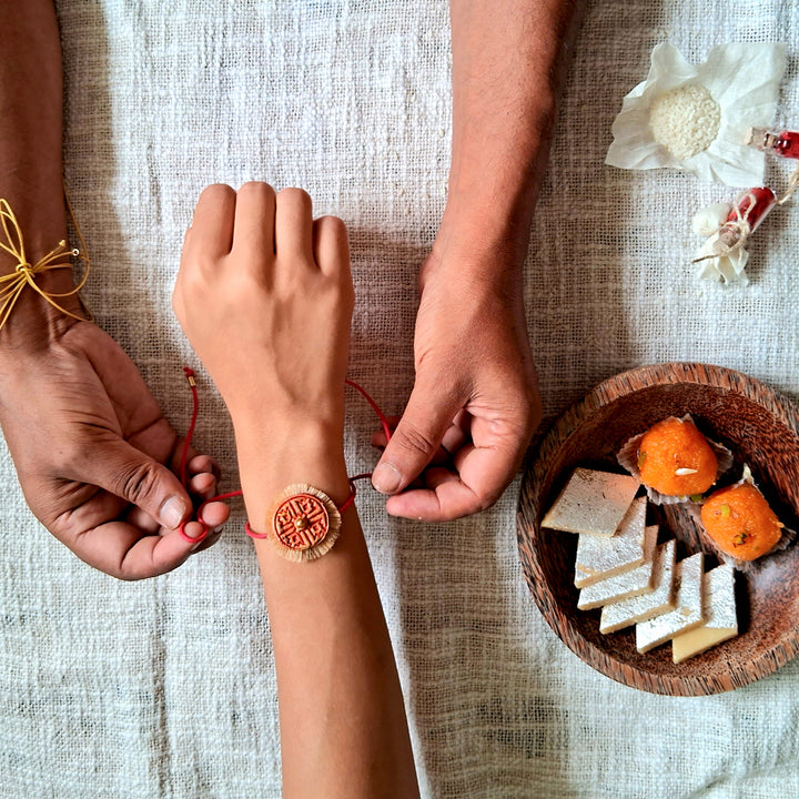 Handmade Papier Mache Red & Yellow Swastika Rakhi With Roli Chawal | Set of 2