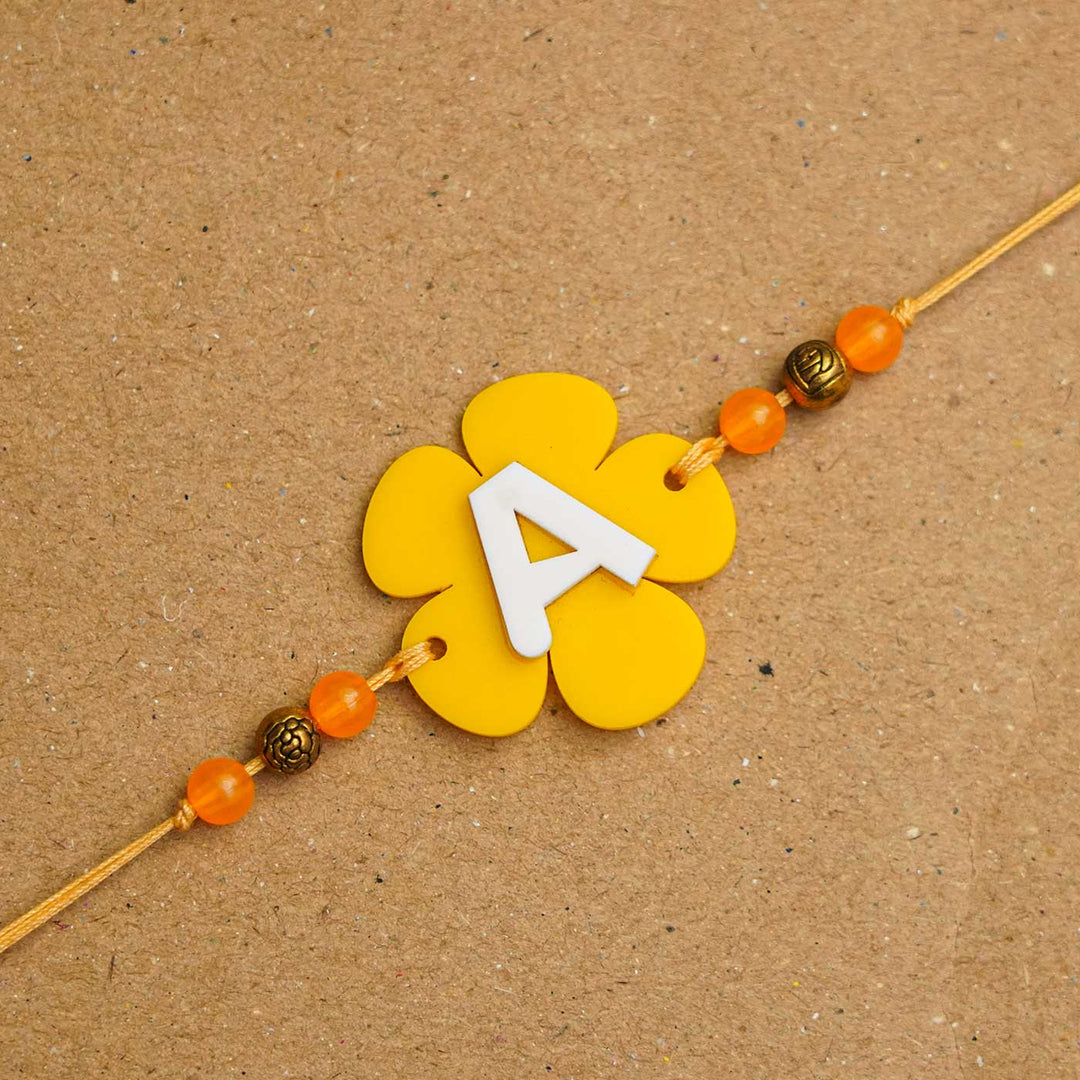 Personalized Handmade Alphabet Flower Acrylic Rakhi With Roli Chawal