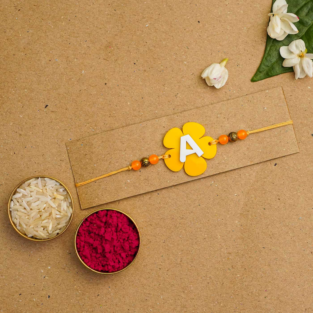 Personalized Handmade Alphabet Flower Acrylic Rakhi With Roli Chawal