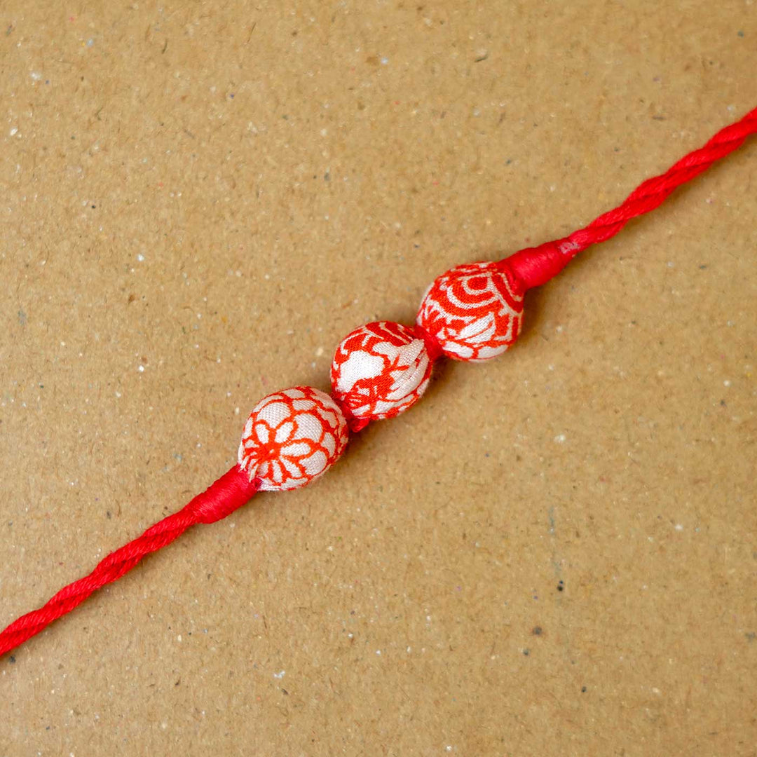 Handmade Red Upcycled Fabric  Rakhi  With Roli Chawal