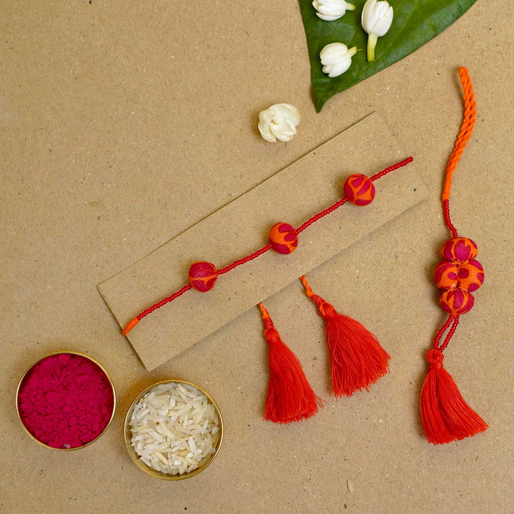 Handmade Kesari Potli Upcycled Fabric Bhaiya Bhabhi Rakhi With Roli Chawal | Set of 2