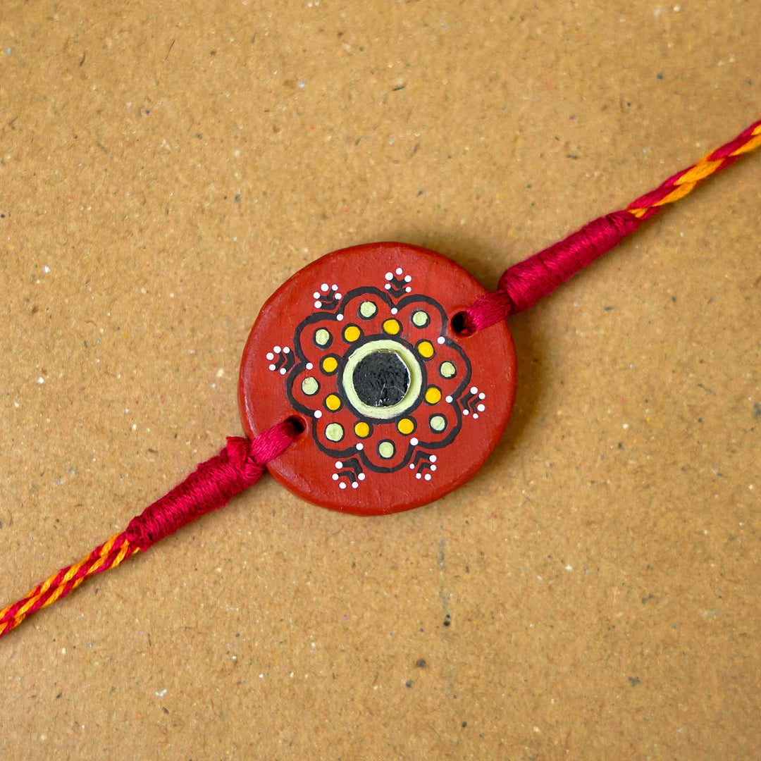 Hand-painted Dharti Terracotta Rakhi  With Roli Chawal