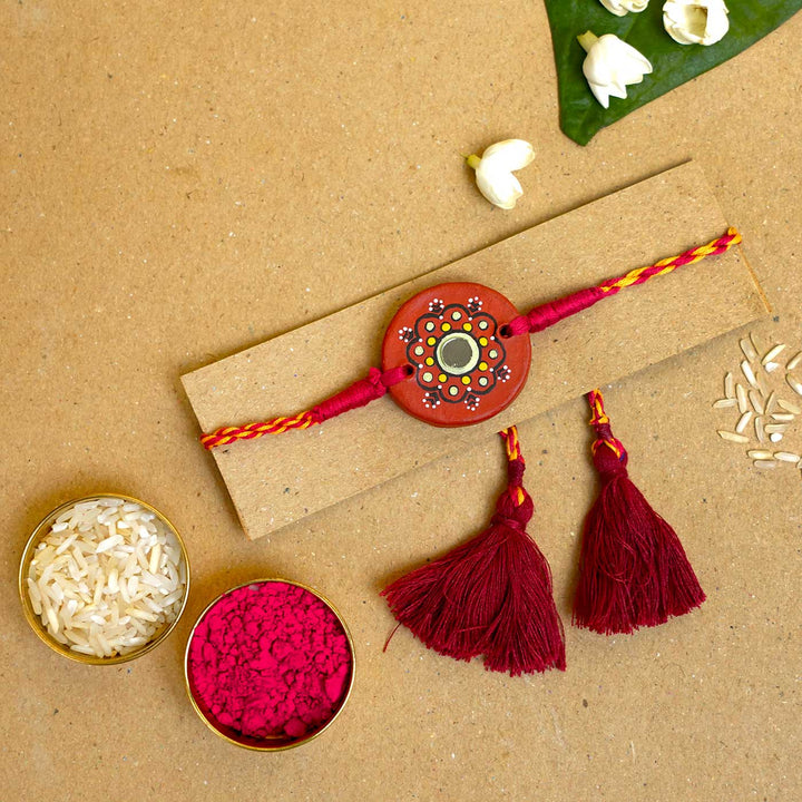 Hand-painted Dharti Terracotta Rakhi  With Roli Chawal