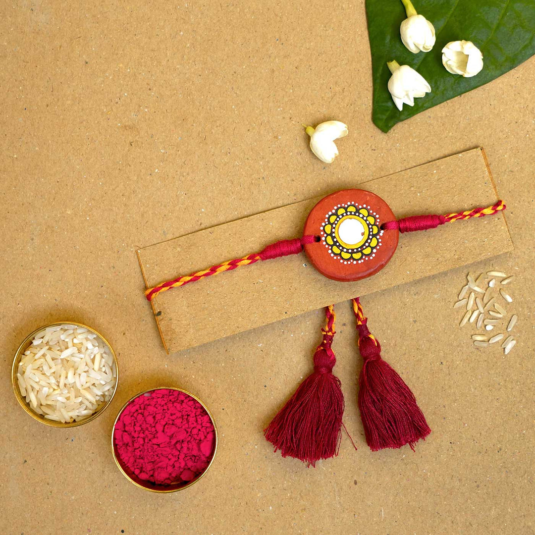 Hand-painted Suraj Terracotta Rakhi  With Roli Chawal