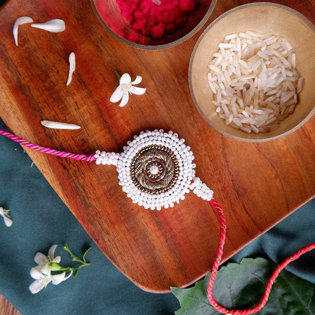 Handmade Zardozi White Bead Border Rakhi With Wooden Box & Roli Chawal