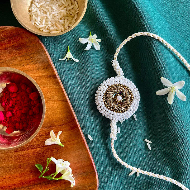 Handmade Zardozi White Bead Border Rakhi With Wooden Box & Roli Chawal