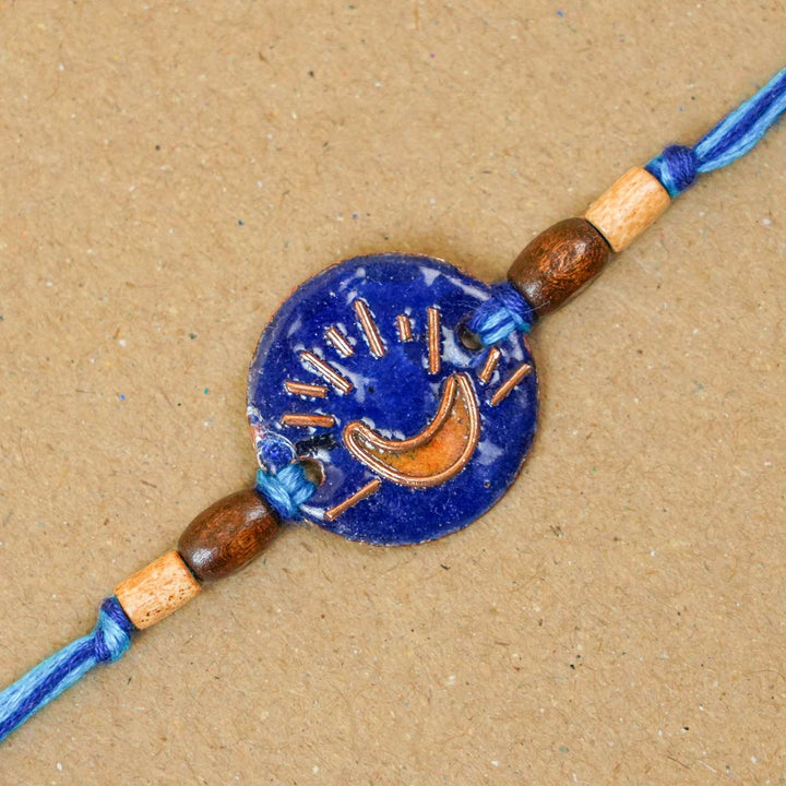 Handmade Chanda Blue Copper Enamel Rakhi With Chocolates & Roli Chawal