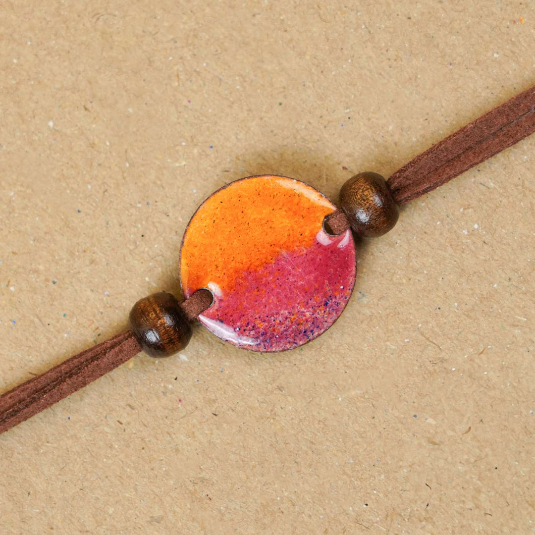 Handmade Ambar Yellow Copper Enamel Rakhi With Chocolates & Roli Chawal