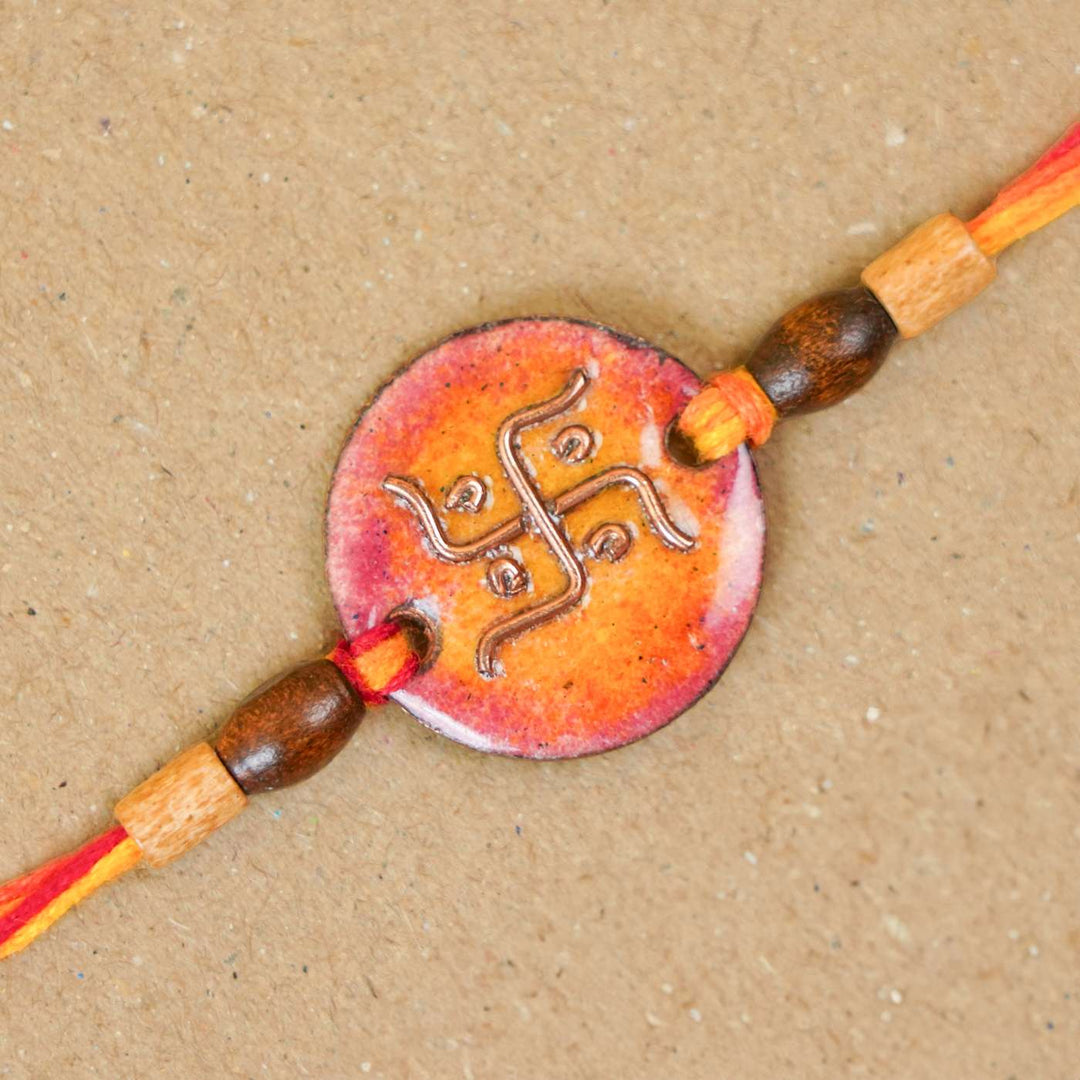 Handmade Swastika Copper Enamel Rakhi With Chocolates & Roli Chawal