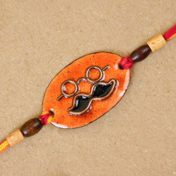 Handmade Mooch Copper Enamel Rakhi With Chocolates & Roli Chawal