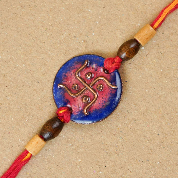 Handmade Swastika Copper Enamel Rakhi With Chocolates & Roli Chawal