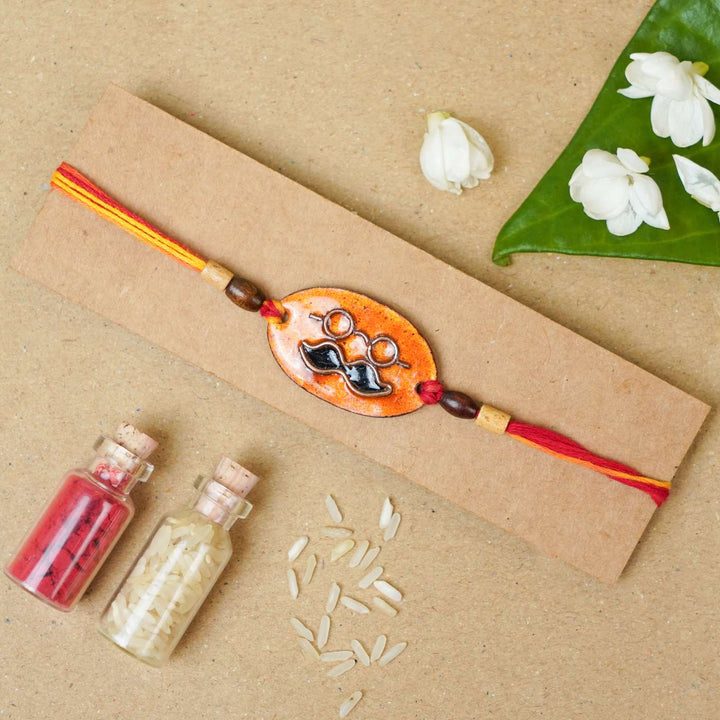 Handmade Mooch Copper Enamel Rakhi With Chocolates & Roli Chawal