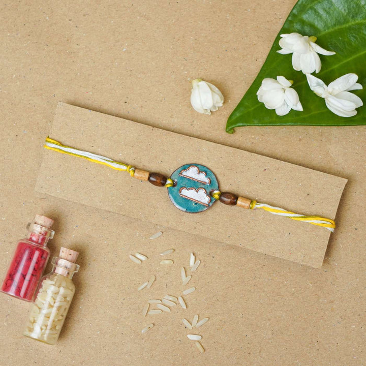 Handmade Baadal Blue Copper Enamel Rakhi With Chocolates & Roli Chawal