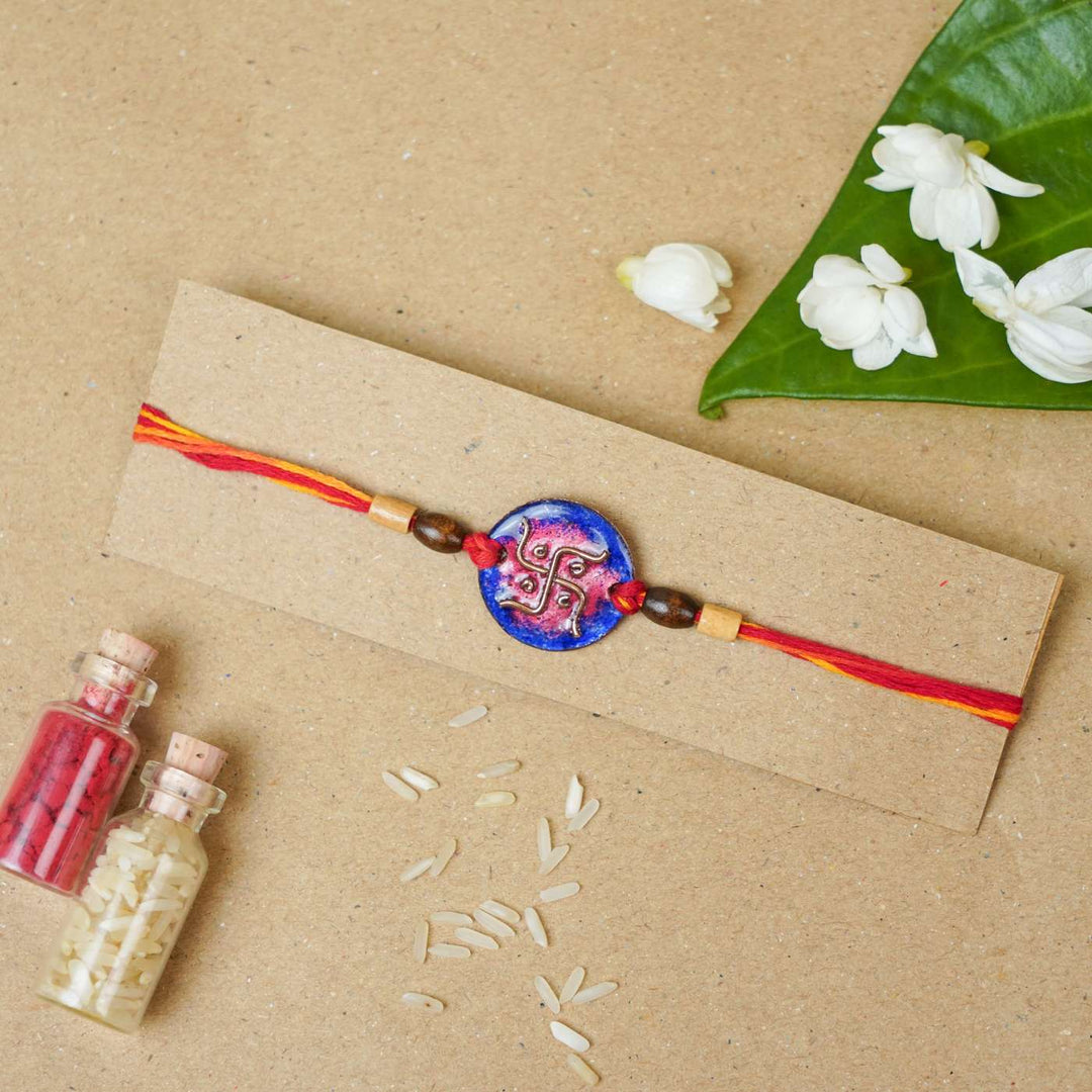 Handmade Swastika Copper Enamel Rakhi With Chocolates & Roli Chawal