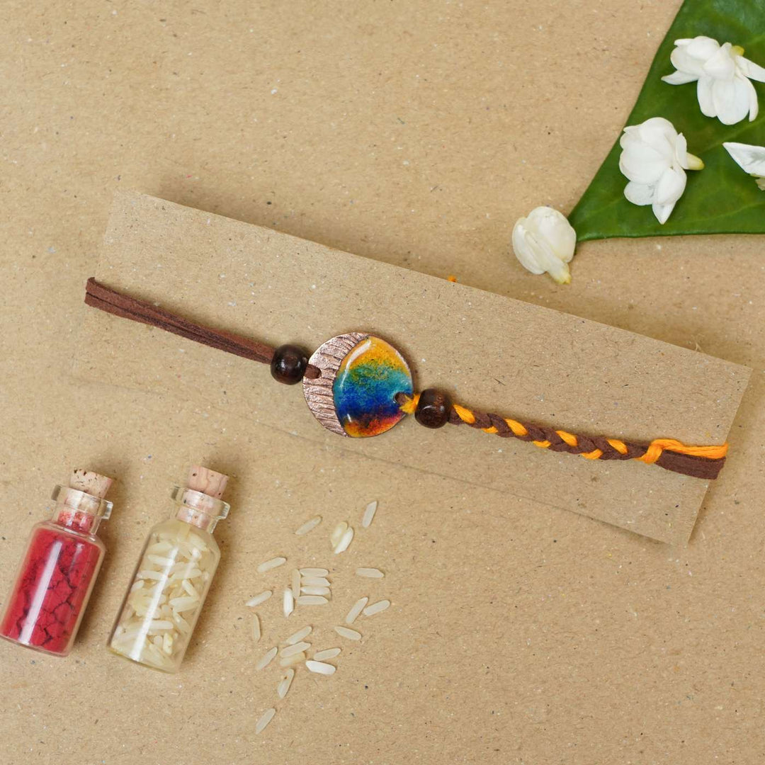 Handmade Indraa Textured Multicolour Copper Enamel Rakhi With Chocolates & Roli Chawal