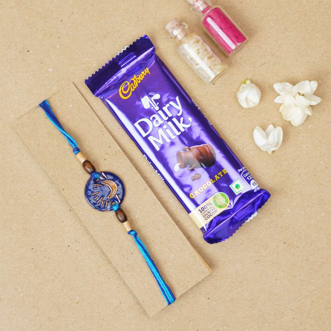 Handmade Chanda Blue Copper Enamel Rakhi With Chocolates & Roli Chawal