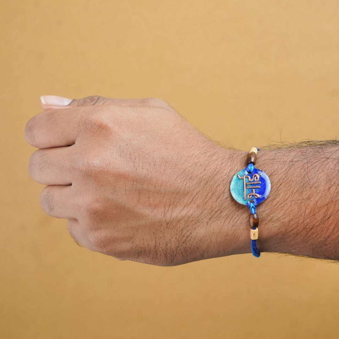 Handmade Bhai Blue Copper Enamel Rakhi With Chocolates & Roli Chawal