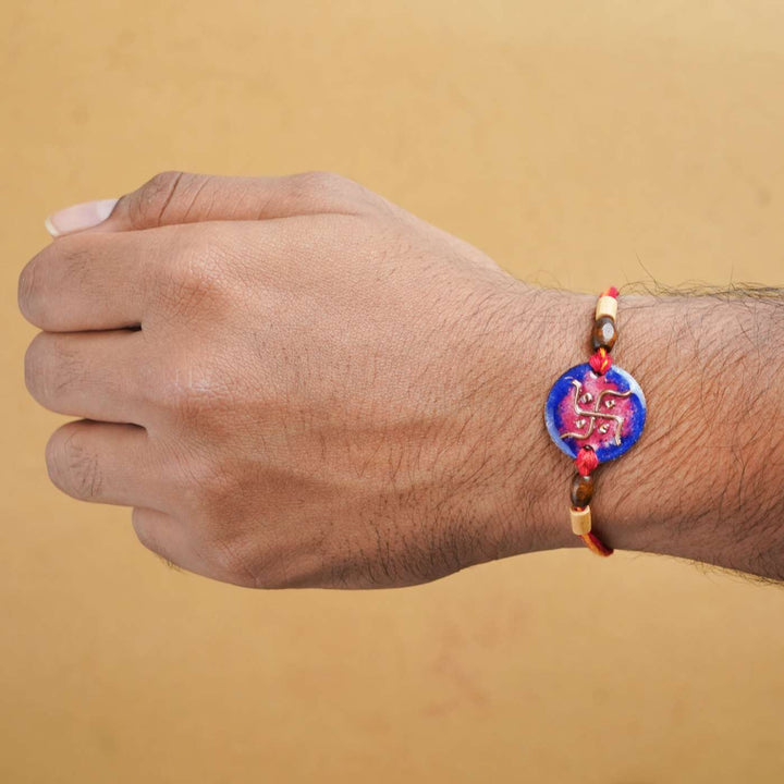 Handmade Swastika Copper Enamel Rakhi With Chocolates & Roli Chawal