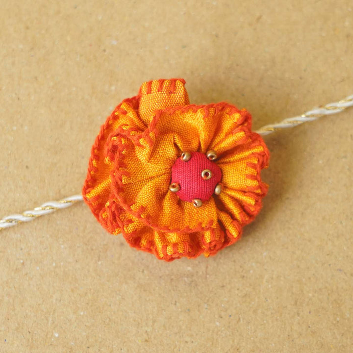 Handmade Genda Phool Upcycled Fabric Rakhi With Roli Chawal