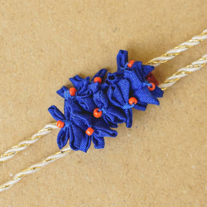 Handmade Blue Cluster Flowers Upcycled Fabric Rakhi With Roli Chawal