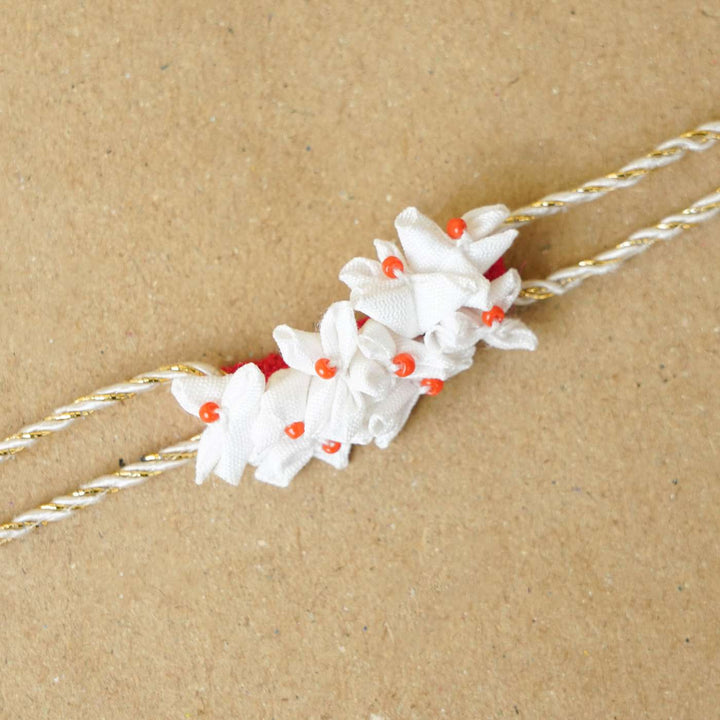 Handmade White Cluster Flower Upcycled Fabric Rakhi With Roli Chawal