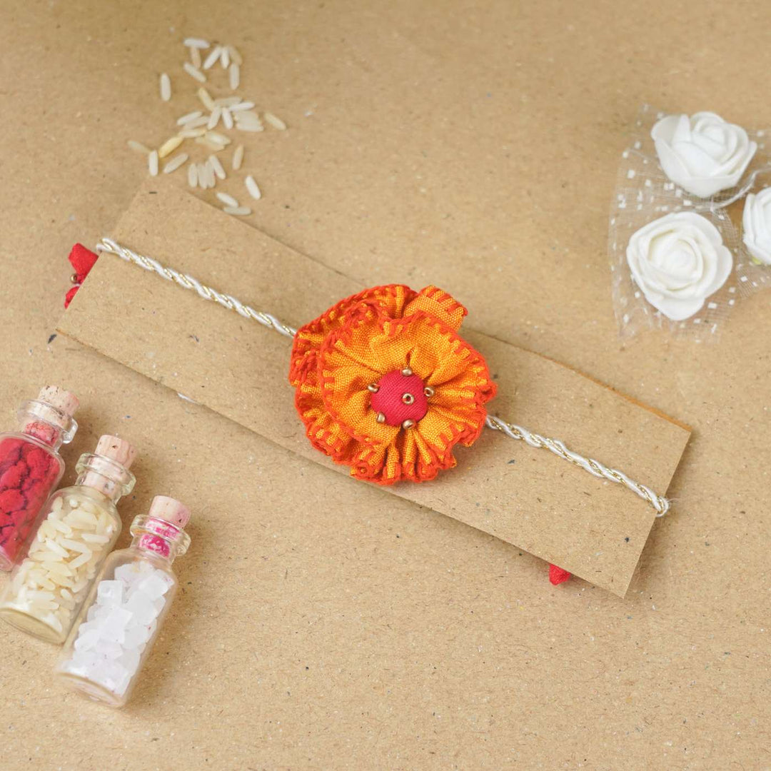 Handmade Genda Phool Upcycled Fabric Rakhi With Roli Chawal