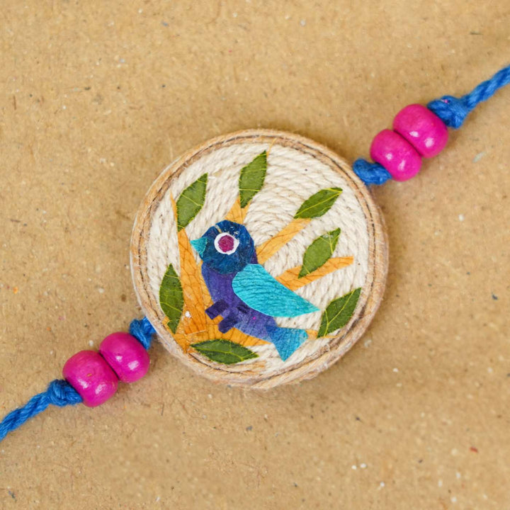 Handmade Pressed Flower Art Bluebird Jute Rakhi With Roli Chawal