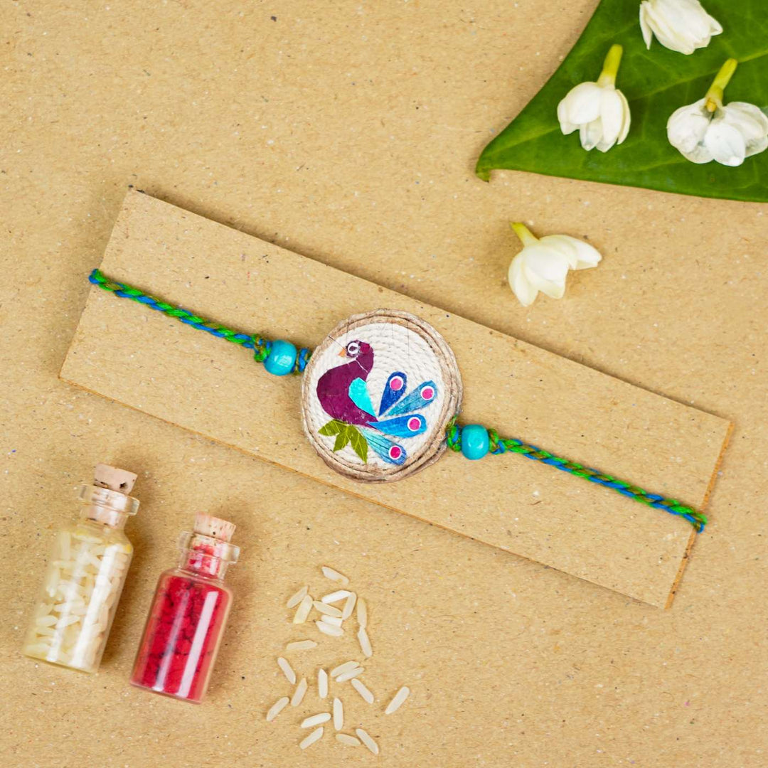 Handmade Pressed Flower Art Peacock Jute Rakhi With Roli Chawal