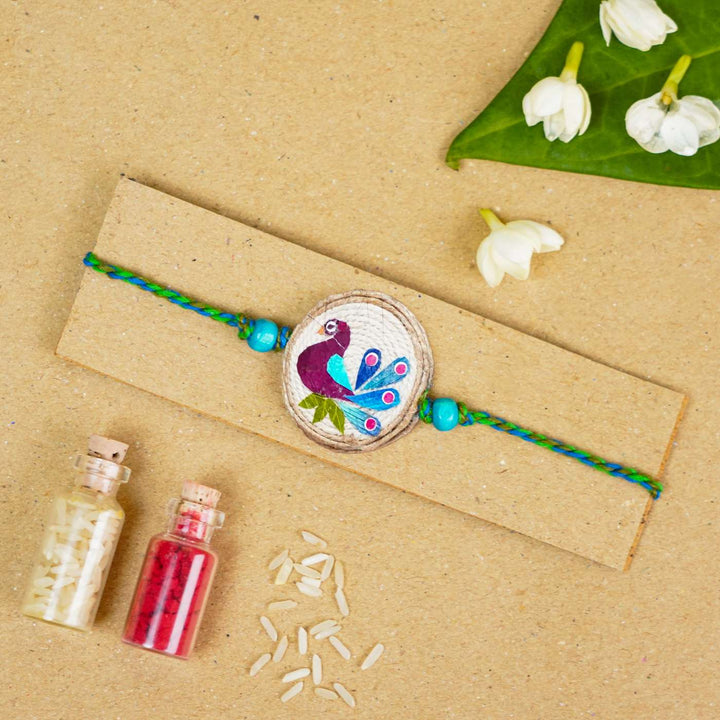 Handmade Pressed Flower Art Peacock Jute Rakhi With Roli Chawal