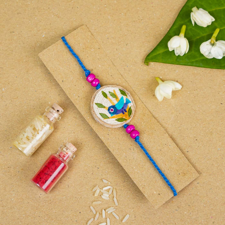 Handmade Pressed Flower Art Bluebird Jute Rakhi With Roli Chawal