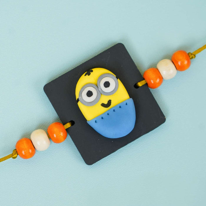 Handmade Miniature Clay Minion Kids Rakhi With Roli Chawal