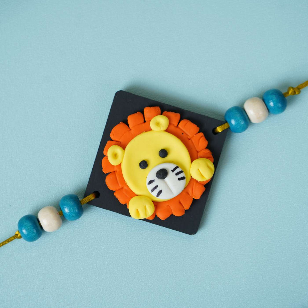 Handmade Miniature Clay Lion Themed Kids Rakhi With Roli Chawal