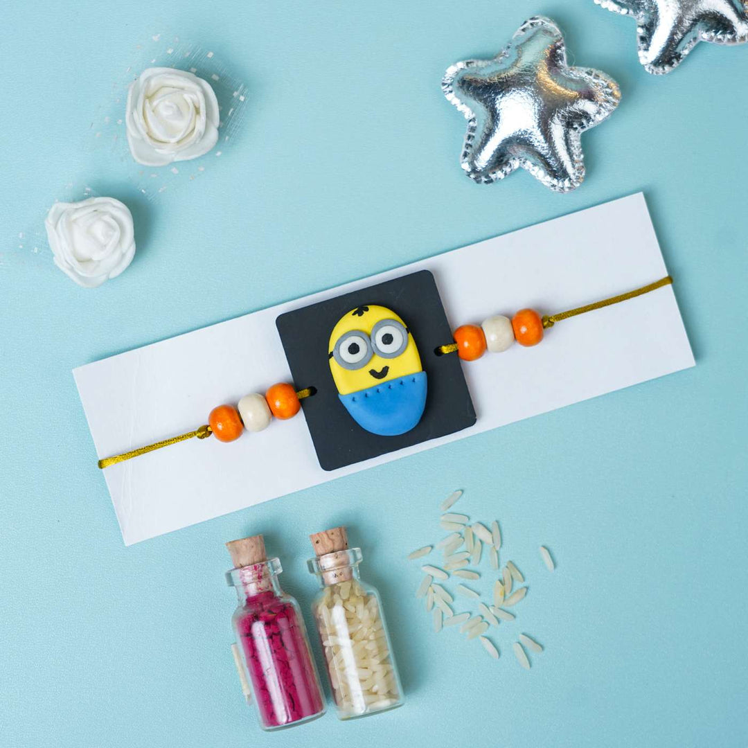 Handmade Miniature Clay Minion Kids Rakhi With Roli Chawal