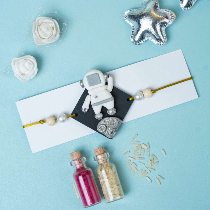 Handmade Miniature Clay Astronaut Kids Rakhi With Roli Chawal