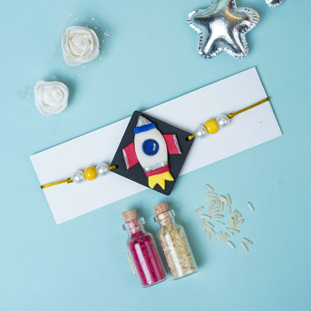 Handmade Miniature Clay Space Rocket Kids Rakhi With Roli Chawal