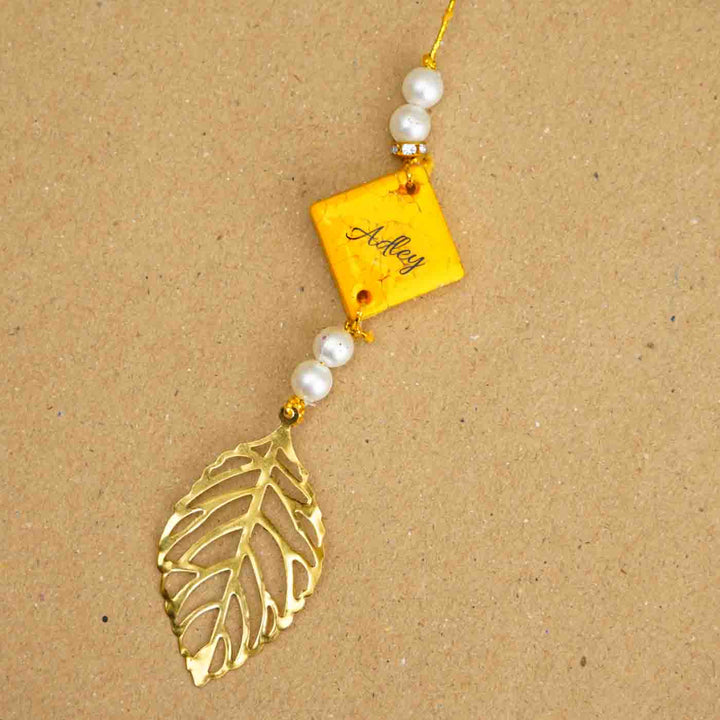 Personalized Handmade Yellow Resin Lumba Rakhi for Bhabhi With Roli Chawal