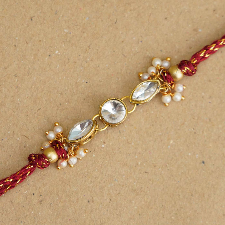 Handmade White Kundan & Pearl Rakhi With Roli Chawal