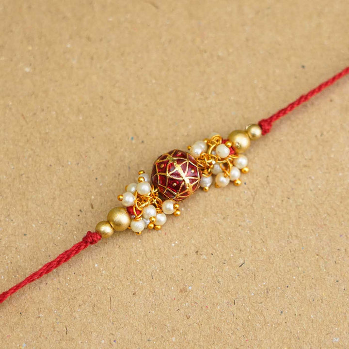 Handmade Red Meena Bead & Pearl Rakhi With Roli Chawal