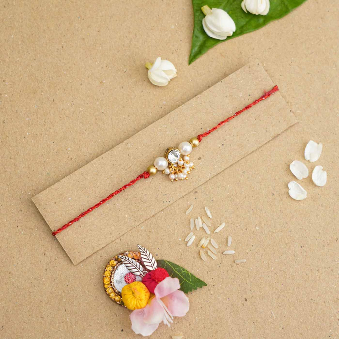 Handmade Kundan Red and White Beads Rakhi With Roli Chawal