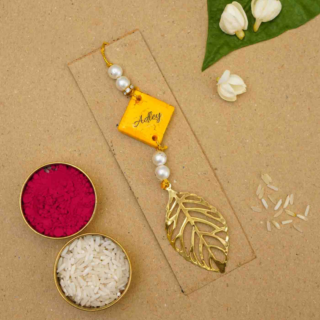 Personalized Handmade Yellow Resin Lumba Rakhi for Bhabhi With Roli Chawal