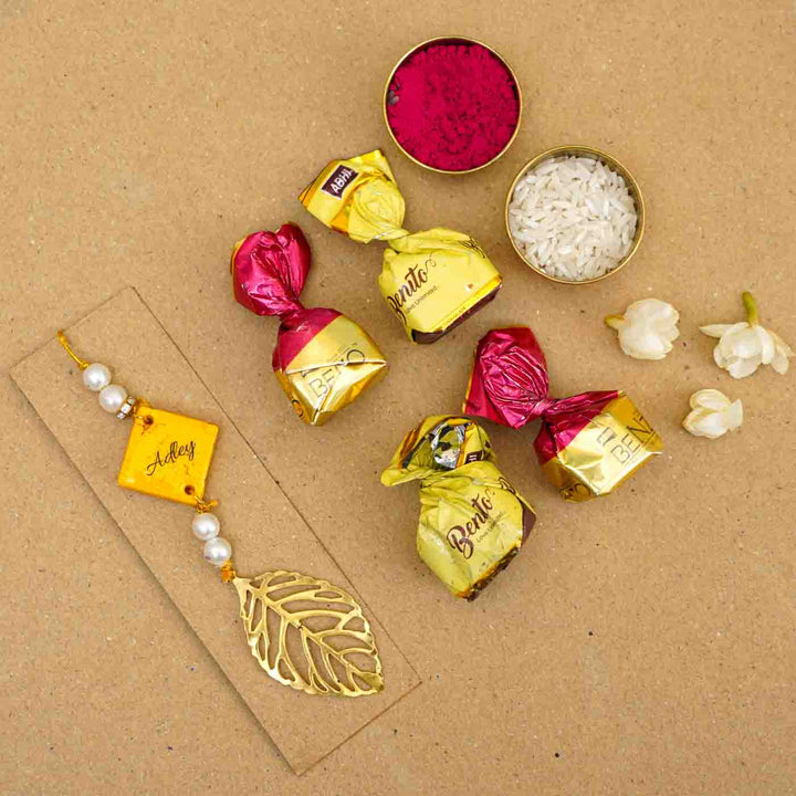 Personalized Handmade Yellow Resin Lumba Rakhi for Bhabhi With Roli Chawal