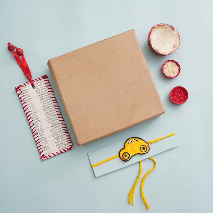 Handmade Ecofriendly Yellow Car Recycled Paper Rakhi With Roli Chawal