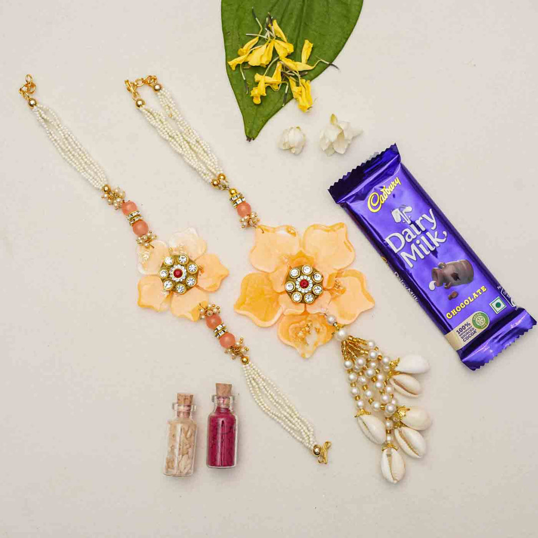 Handmade Yellow Flower Theme Resin Bhaiya Bhabhi Rakhi With Chocolates & Roli Chawal For Bhaiya and Bhabhi | Set of 2