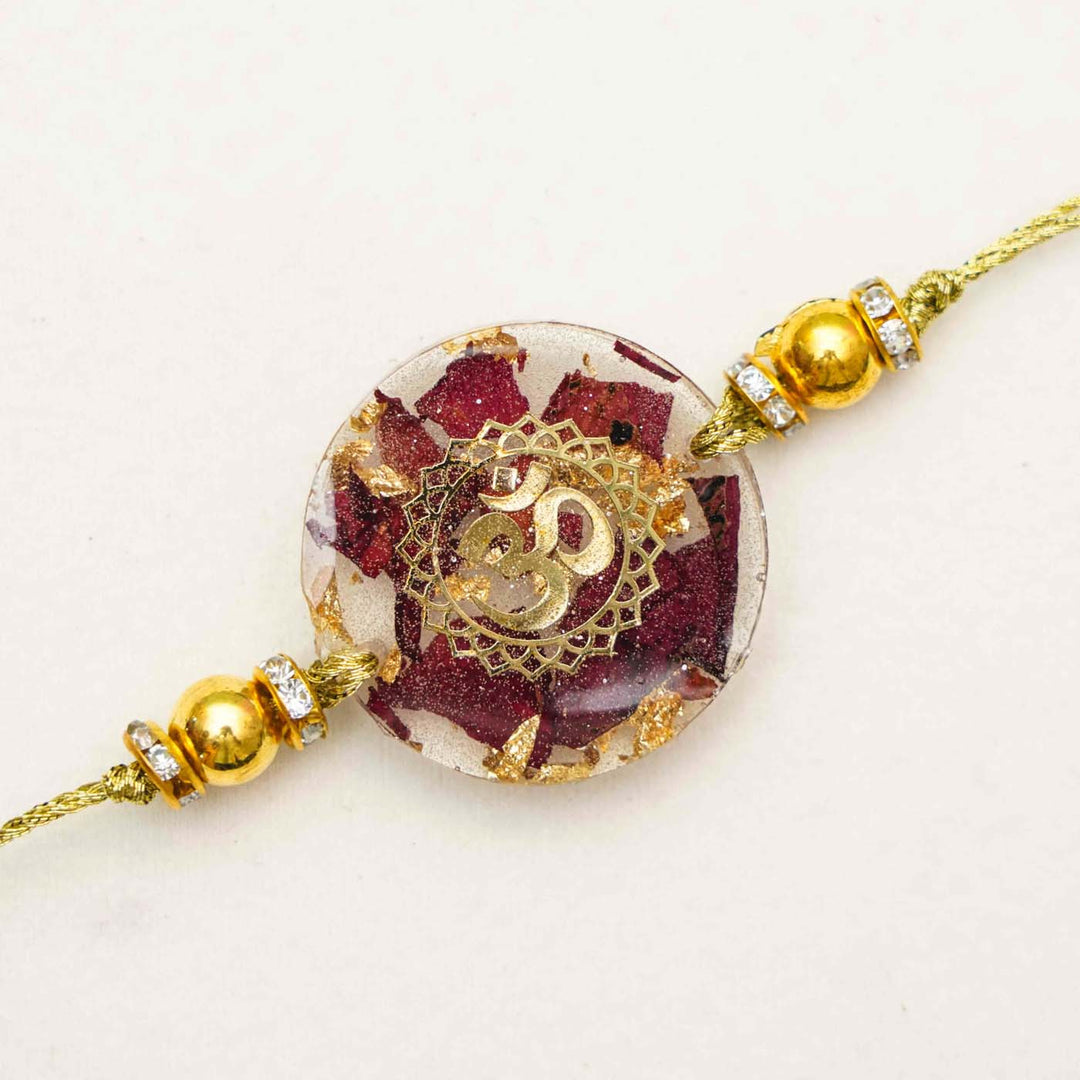 Handmade Resin Round Om Preserved Flower Rakhi With Roli Chawal