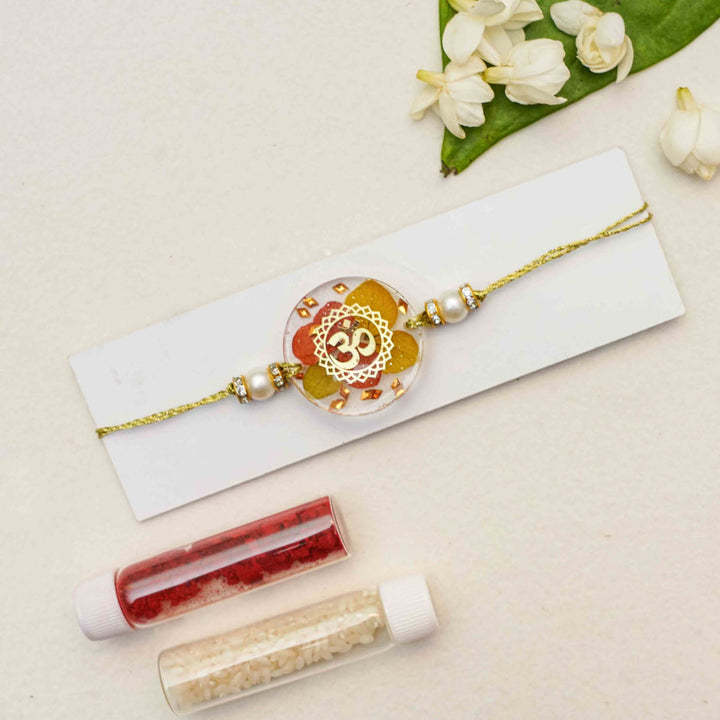 Handmade Resin Round Om Preserved Flower Rakhi With Roli Chawal