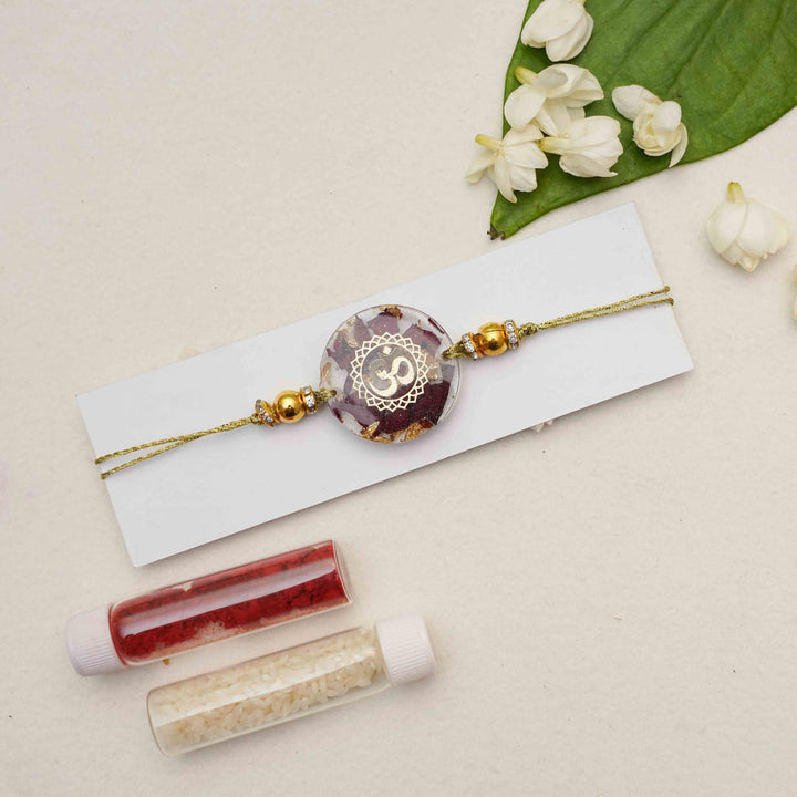 Handmade Resin Round Om Preserved Flower Rakhi With Roli Chawal